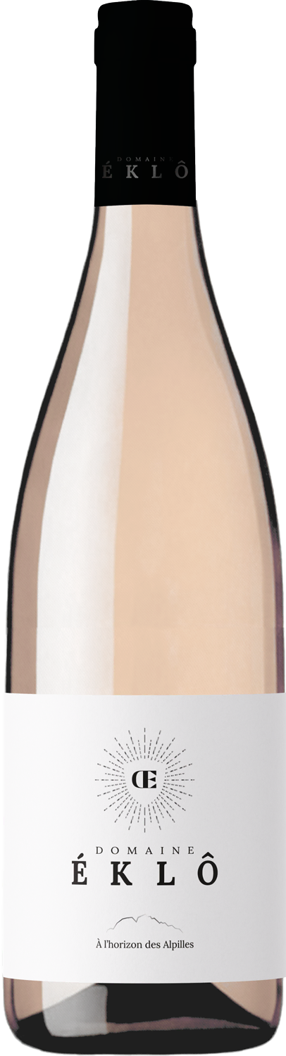 Bottle of Domaine Éklô rosé wine with minimalist white label featuring a sunburst design and the text À l'horizon des Alpilles.